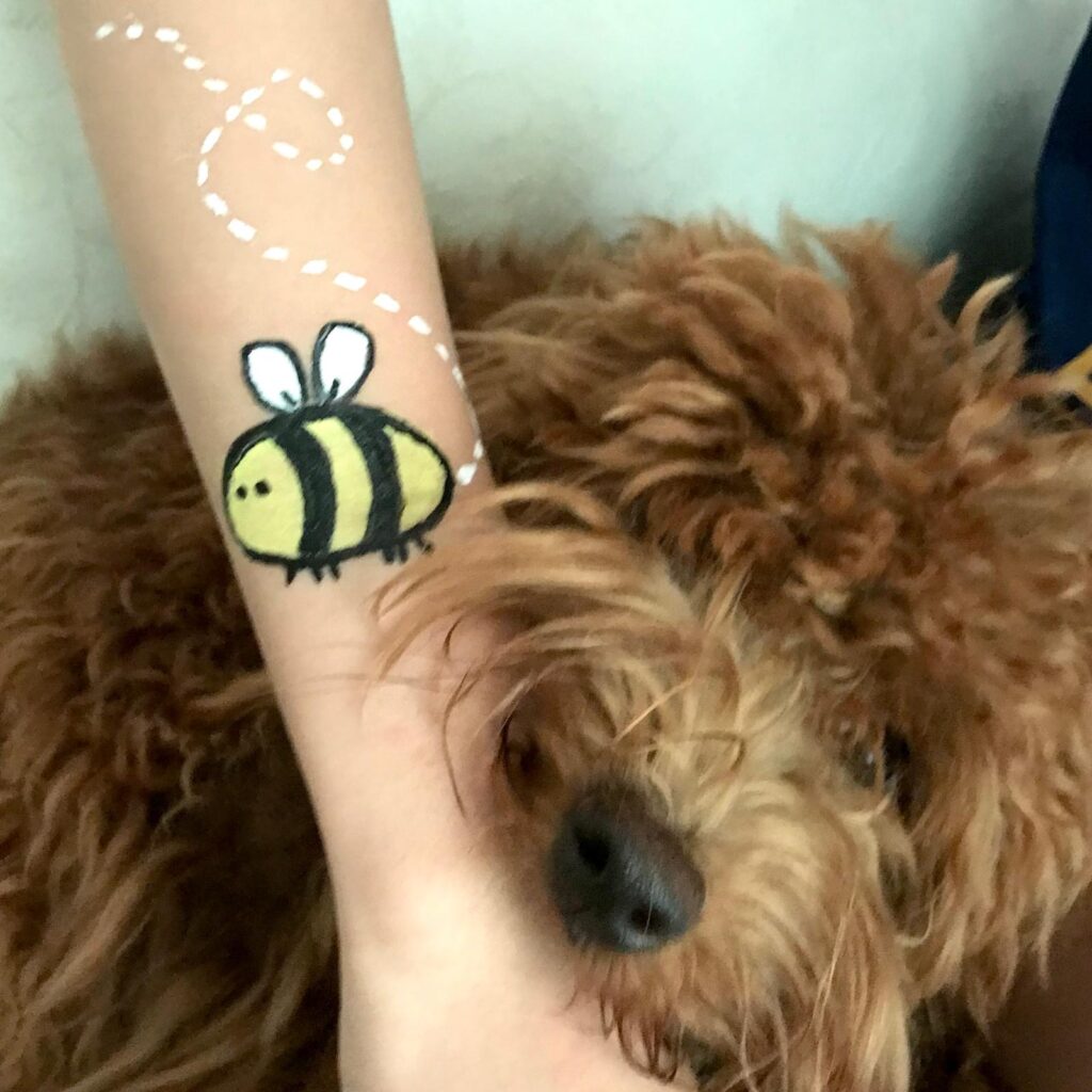 Facepainting for Children's parties by The Kindled Collective - bumble bee design on forearm