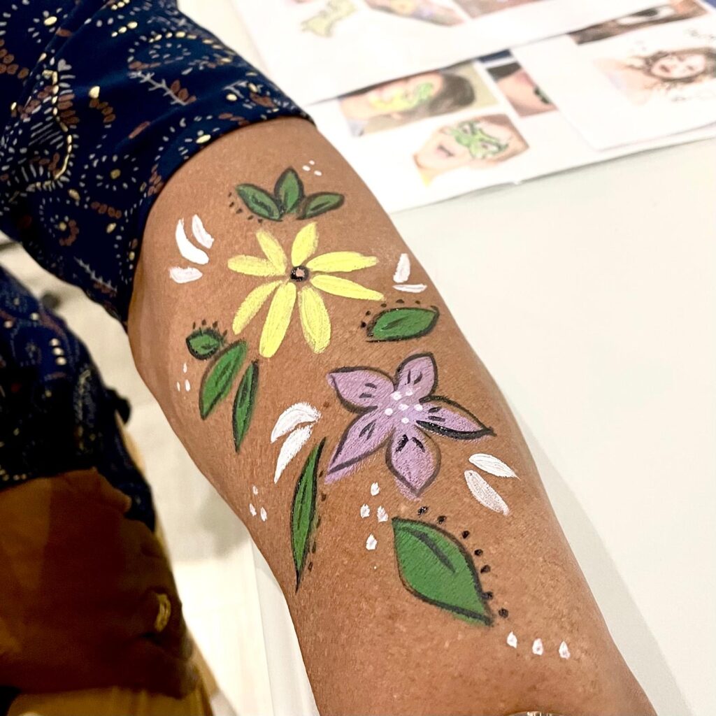 Facepainting for Children's parties by The Kindled Collective - flower design on hand, indian deepavali themed facepainting service