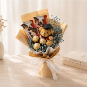 A graduation bouquet with our all-time favourite chocolates, mini graduation bear, and dried baby’s breath! Suitable for both guys and girls. A bouquet you can admire and also eat! Dried blue baby's breath, with two kinder buenos and three ferrero roceher chocolates. Wrapped in rustic brown kraft paper with white ribbon.