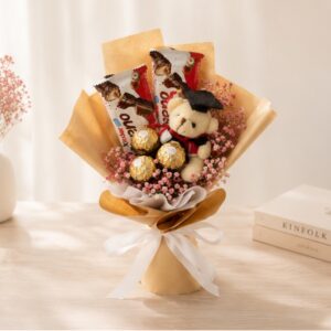 A graduation bouquet with our all-time favourite chocolates, mini graduation bear, and dried baby’s breath! Suitable for both guys and girls. A bouquet you can admire and also eat! Dried red baby's breath, with two kinder buenos and three ferrero roceher chocolates. Wrapped in rustic brown kraft paper with white ribbon.